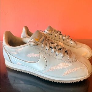 Nike Classic Cortez Sneakers in Light Blue with White Embroidered Feathers